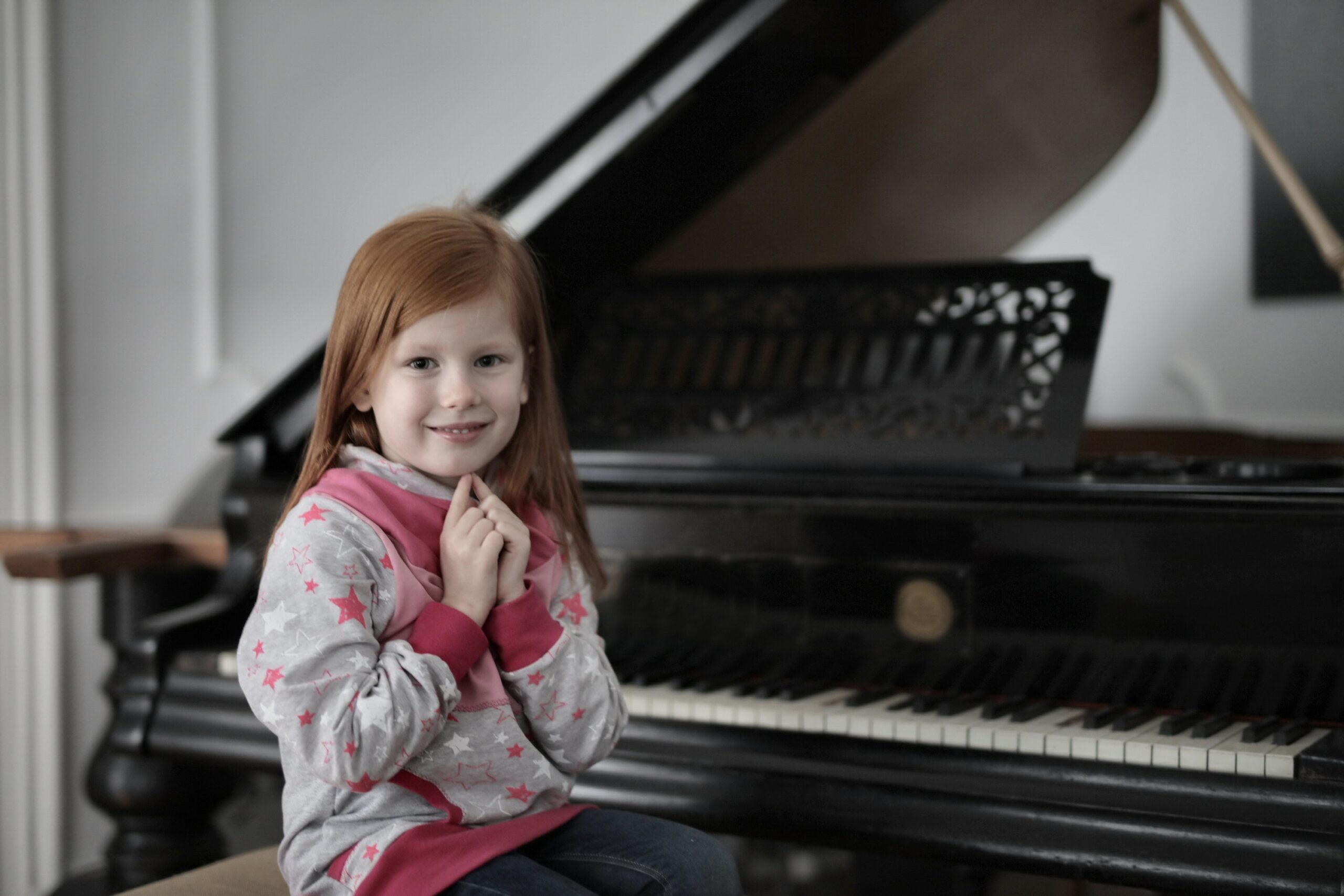 child taking piano lessons.