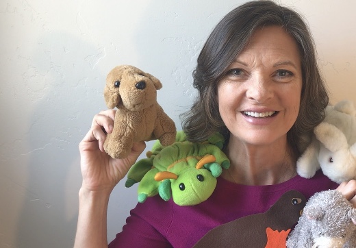 kristin with stuffed animals from her online toddler music class