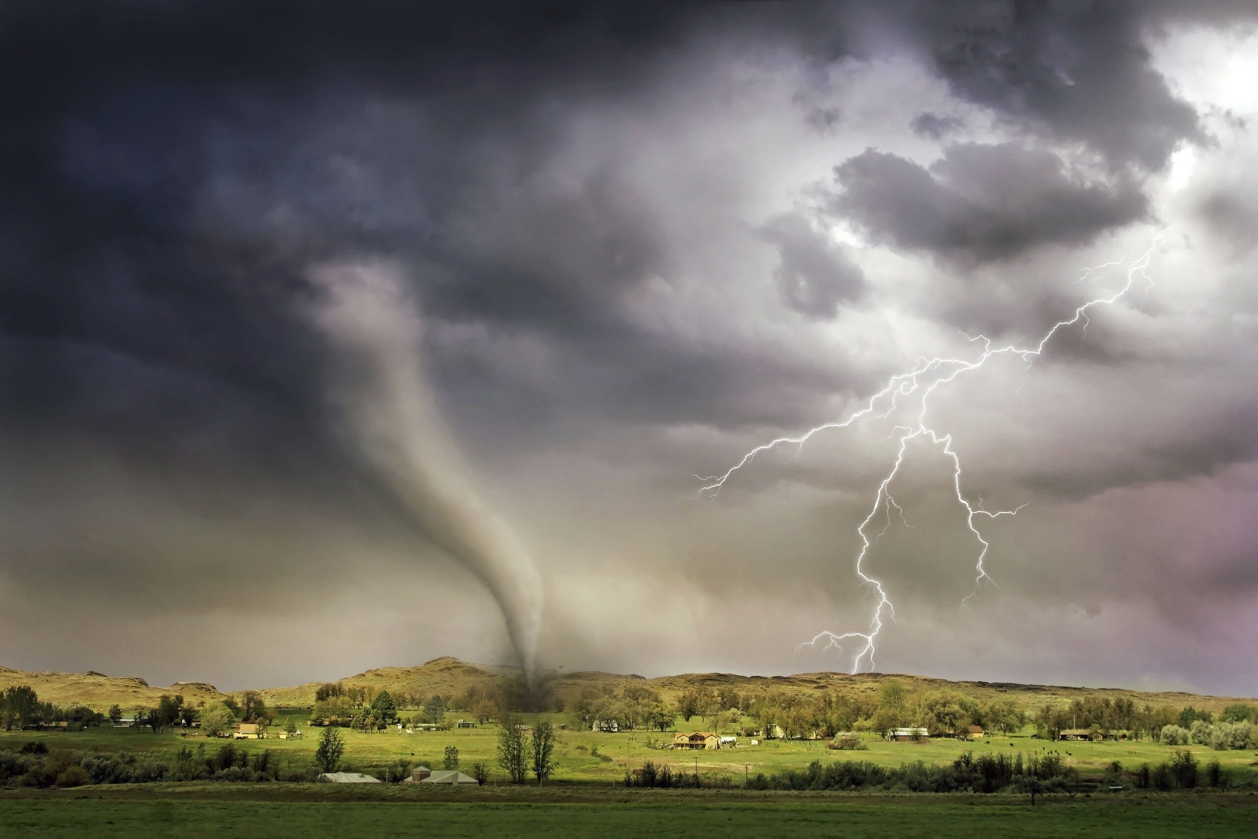 lightning and tornado hitting landscape